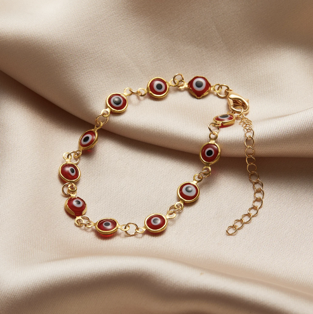 Red 18 Karat Gold Plated bracelet against the evil eye