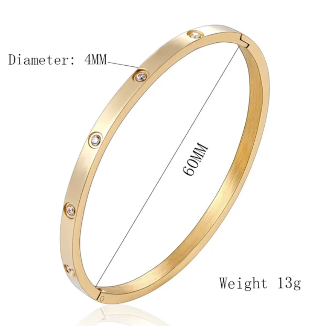 18 Karat Gold Plated solid bracelet with inlaid zirconias